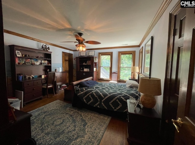 415 Pine St, Camden, SC 29020 - bedroom with wood finished floors, ornamental molding, and a ceiling fan