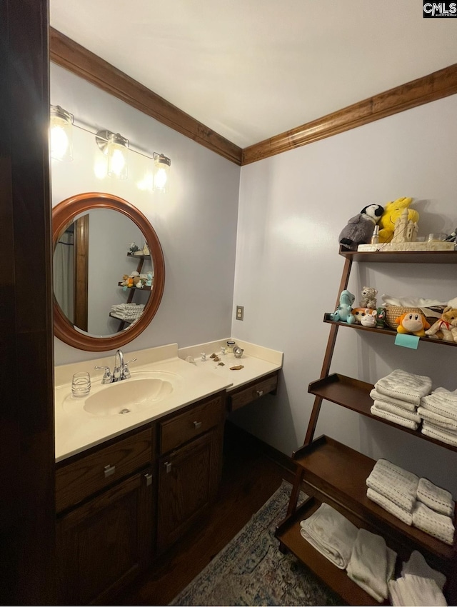 415 Pine St, Camden, SC 29020 - bathroom featuring ornamental molding, wood finished floors, and vanity