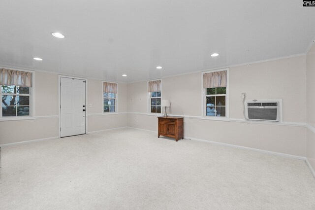 415 Pine St, Camden, SC 29020 - unfurnished living room featuring carpet floors, recessed lighting, a wall unit AC, baseboards, and ornamental molding