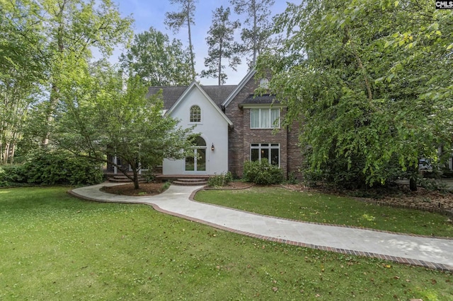 415 Pine St, Camden, SC 29020 - tudor home featuring a front lawn and stucco siding
