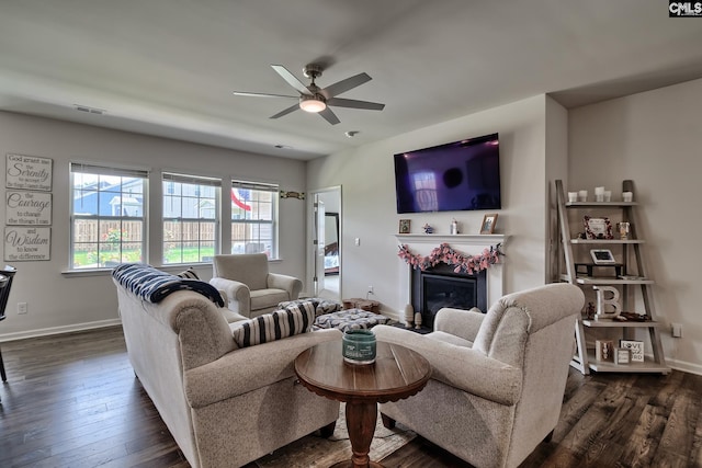 837 Marigold Ln, Lexington, SC 29072 - living area featuring ceiling fan, baseboards, dark wood-type flooring, and a glass covered fireplace