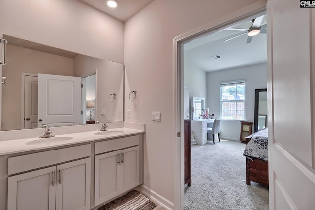 837 Marigold Ln, Lexington, SC 29072 - ensuite bathroom featuring ceiling fan, double vanity, and baseboards