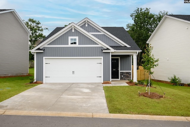 342 Secretariat St, Lexington, SC 29073 - craftsman-style house featuring board and batten siding, a front lawn, concrete driveway, and roof with shingles