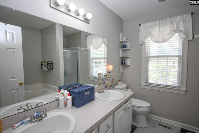 91 Loggerhead Dr, Columbia, SC 29229 - full bath with a stall shower, toilet, double vanity, a garden tub, and healthy amount of natural light
