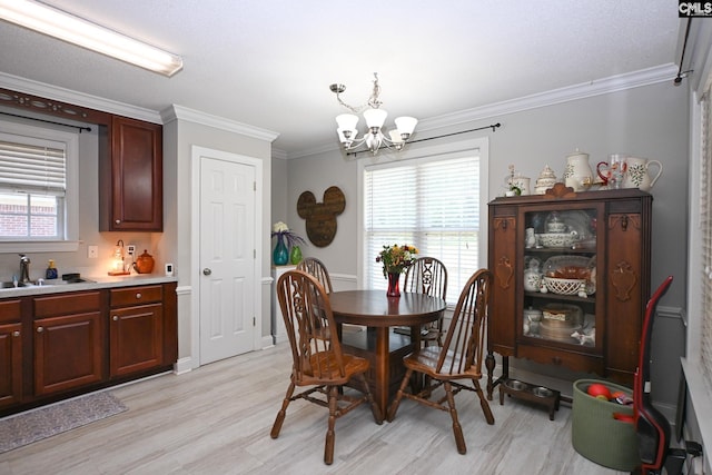 91 Loggerhead Dr, Columbia, SC 29229 - dining space with a chandelier, ornamental molding, and light wood finished floors