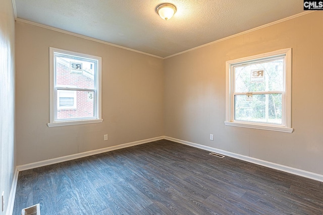 711 Parrish Dr, Mullins, SC 29574 - spare room with crown molding, dark wood-type flooring, a textured ceiling, and baseboards