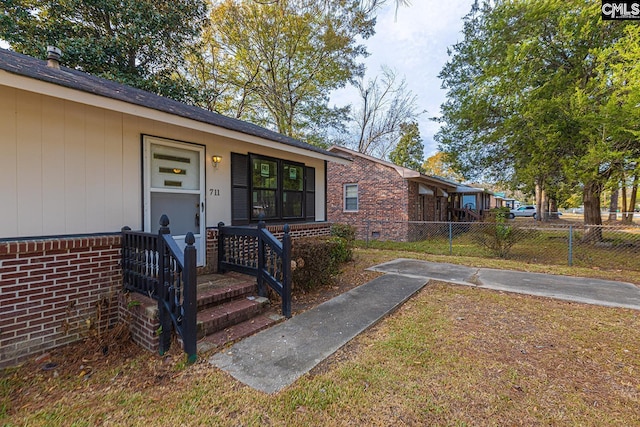 711 Parrish Dr, Mullins, SC 29574 - doorway to property with brick siding