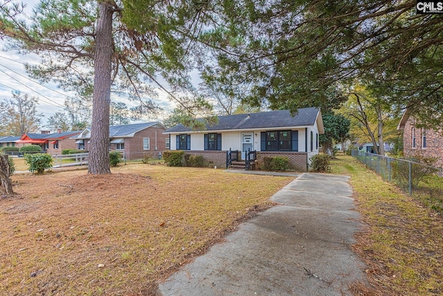 711 Parrish Dr, Mullins, SC 29574 - view of front of house featuring brick siding and concrete driveway