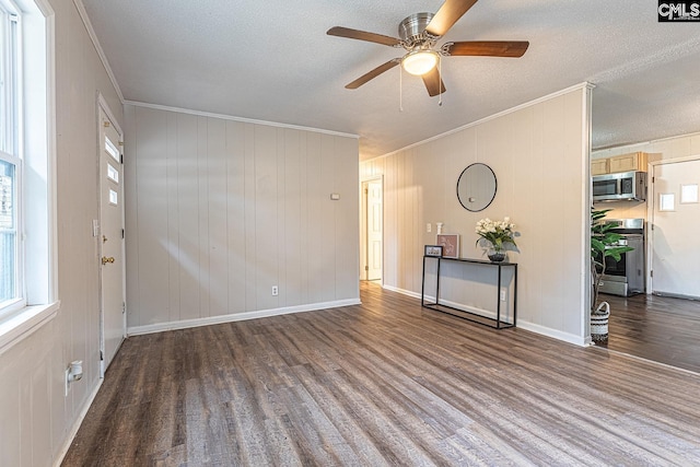 711 Parrish Dr, Mullins, SC 29574 - unfurnished room featuring crown molding, wood finished floors, a ceiling fan, a textured ceiling, and baseboards