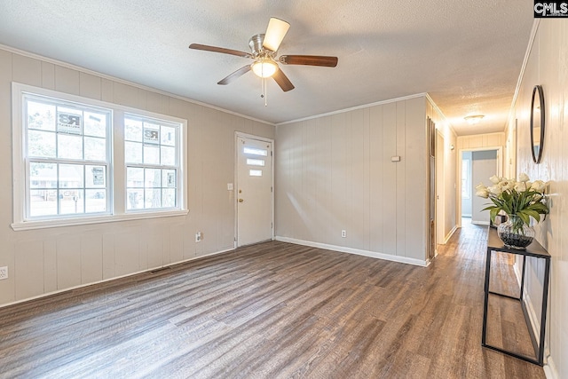 711 Parrish Dr, Mullins, SC 29574 - empty room featuring wood finished floors, a textured ceiling, crown molding, a ceiling fan, and baseboards