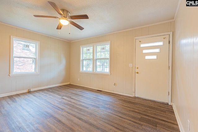 711 Parrish Dr, Mullins, SC 29574 - entryway with wood finished floors, crown molding, ceiling fan, baseboards, and a textured ceiling
