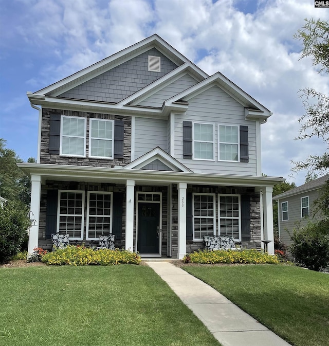 288 Links Crossing Dr, Blythewood, SC 29016 - view of front facade with a front yard, stone siding, and a porch