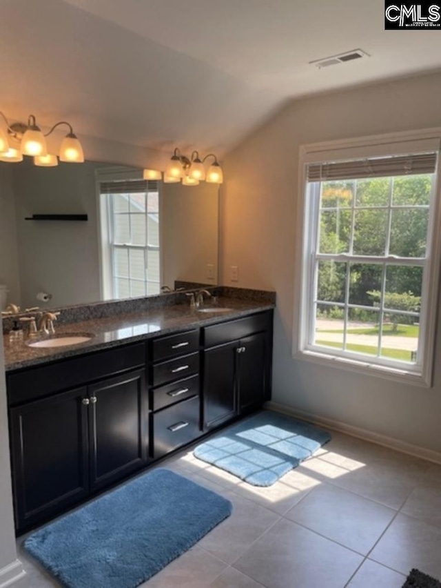 288 Links Crossing Dr, Blythewood, SC 29016 - full bathroom with lofted ceiling, double vanity, tile patterned flooring, and baseboards