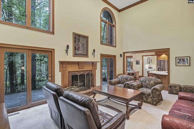832 Longtown Rd, Blythewood, SC 29016 - living room featuring a high ceiling, ornamental molding, carpet flooring, and a fireplace