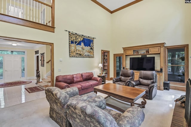 832 Longtown Rd, Blythewood, SC 29016 - living area featuring a towering ceiling, crown molding, plenty of natural light, baseboards, and stairs