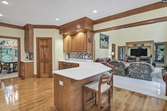 832 Longtown Rd, Blythewood, SC 29016 - kitchen featuring light wood finished floors, decorative backsplash, stainless steel dishwasher, a kitchen bar, and recessed lighting