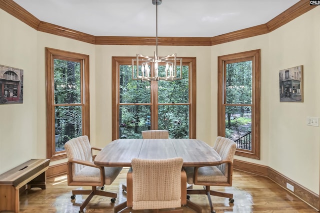 832 Longtown Rd, Blythewood, SC 29016 - dining space featuring a chandelier, wood finished floors, healthy amount of natural light, and ornamental molding