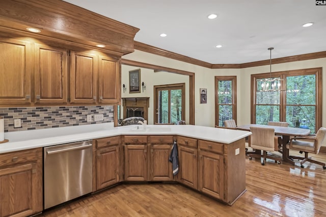 832 Longtown Rd, Blythewood, SC 29016 - kitchen featuring stainless steel dishwasher, light wood-type flooring, brown cabinetry, ornamental molding, and recessed lighting