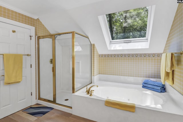 832 Longtown Rd, Blythewood, SC 29016 - bathroom featuring a stall shower, a jetted tub, a skylight, wood finished floors, and wallpapered walls