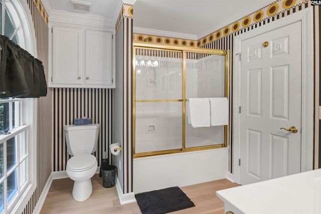 832 Longtown Rd, Blythewood, SC 29016 - full bathroom featuring wood finished floors, combined bath / shower with glass door, toilet, and baseboards