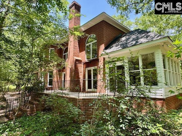 832 Longtown Rd, Blythewood, SC 29016 - rear view of house featuring a chimney and brick siding