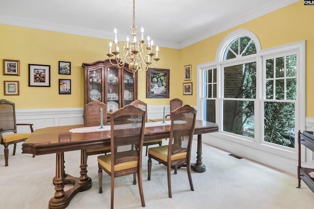 832 Longtown Rd, Blythewood, SC 29016 - dining space featuring light carpet, a chandelier, crown molding, and wainscoting