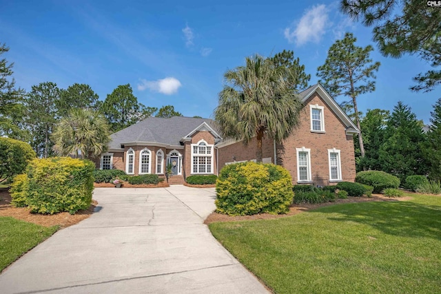 317 Cartgate Cir, Blythewood, SC 29016 - view of front facade featuring brick siding, a front lawn, and concrete driveway
