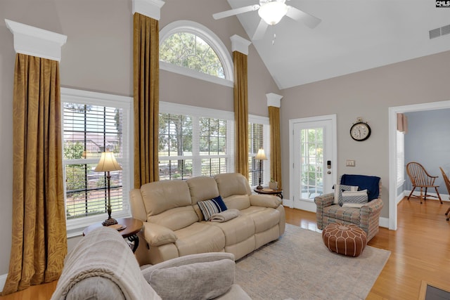 317 Cartgate Cir, Blythewood, SC 29016 - living area with high vaulted ceiling, plenty of natural light, a ceiling fan, light wood-type flooring, and baseboards