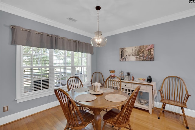 317 Cartgate Cir, Blythewood, SC 29016 - dining room featuring light wood-type flooring, baseboards, and crown molding