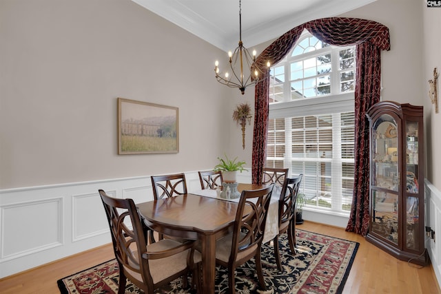 317 Cartgate Cir, Blythewood, SC 29016 - dining area with a chandelier, plenty of natural light, light wood-style flooring, wainscoting, and ornamental molding