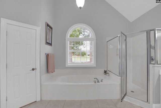 317 Cartgate Cir, Blythewood, SC 29016 - bathroom featuring vaulted ceiling, a shower stall, a garden tub, and tile patterned flooring