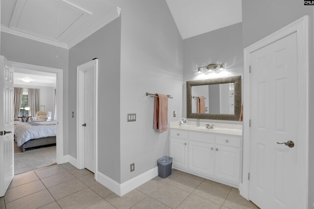 317 Cartgate Cir, Blythewood, SC 29016 - ensuite bathroom featuring vanity, tile patterned floors, vaulted ceiling, and baseboards