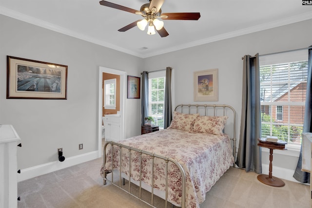 317 Cartgate Cir, Blythewood, SC 29016 - bedroom with light colored carpet, baseboards, crown molding, a ceiling fan, and ensuite bath