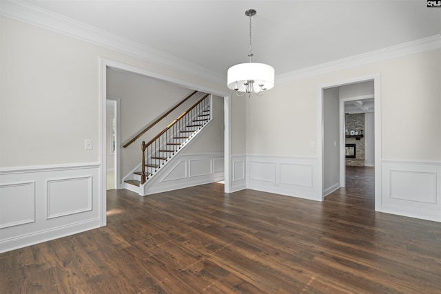 1412 Hammerwood Ln, Westminster, SC 29170 - spare room featuring a chandelier, a decorative wall, stairs, crown molding, and wainscoting