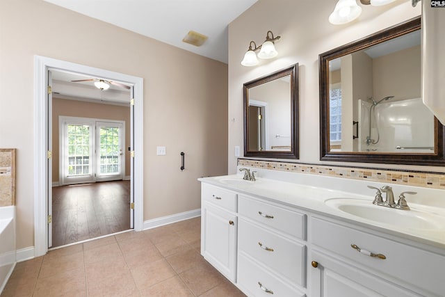 560 Park Place Dr, Elgin, SC 29045 - bathroom featuring baseboards, double vanity, tile patterned floors, a bath, and ceiling fan