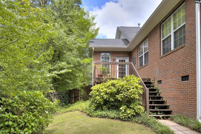 560 Park Place Dr, Elgin, SC 29045 - doorway to property featuring brick siding, a shingled roof, and a deck