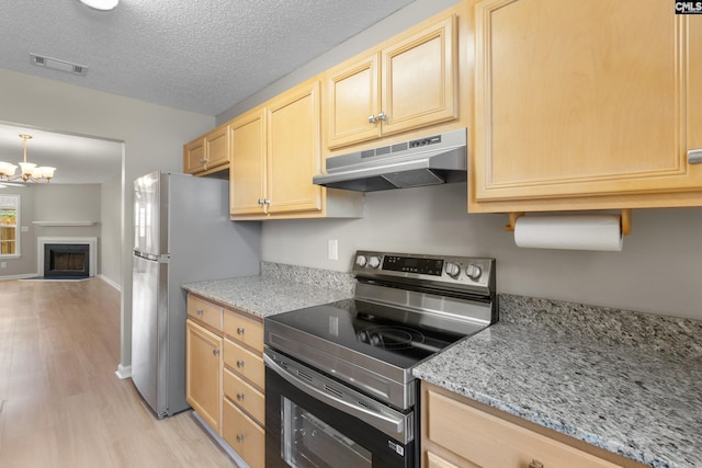 110 Walking Horse Way, Columbia, SC 29223 - kitchen featuring stainless steel appliances, under cabinet range hood, light brown cabinets, light wood-type flooring, and a chandelier