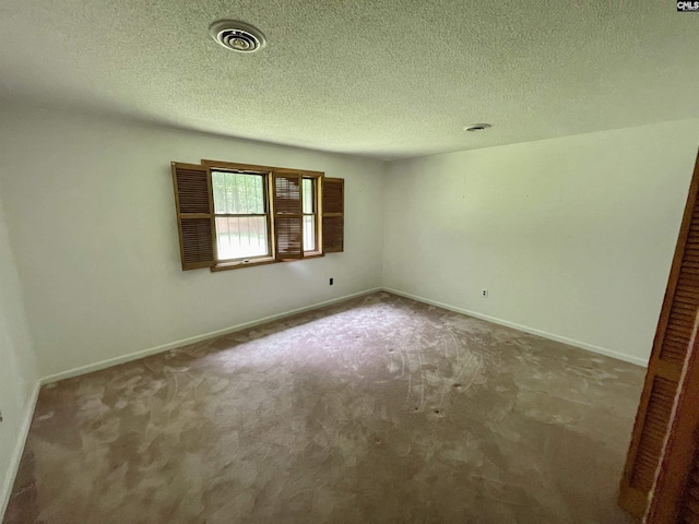 325 Beltline Ave, Batesburg, SC 29006 - carpeted spare room with baseboards and a textured ceiling
