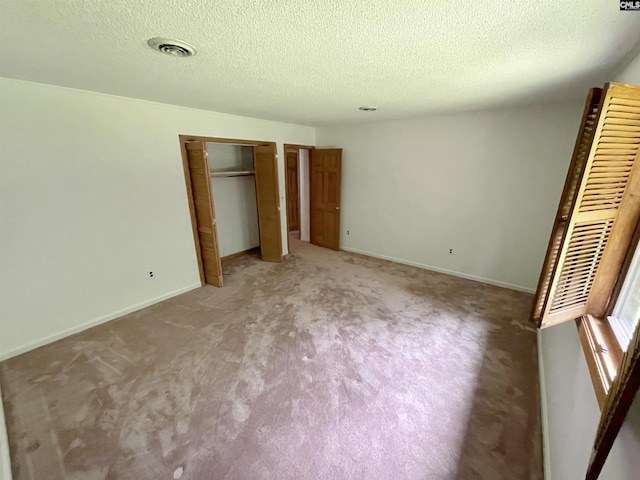 325 Beltline Ave, Batesburg, SC 29006 - unfurnished bedroom with carpet floors, a textured ceiling, baseboards, and a closet