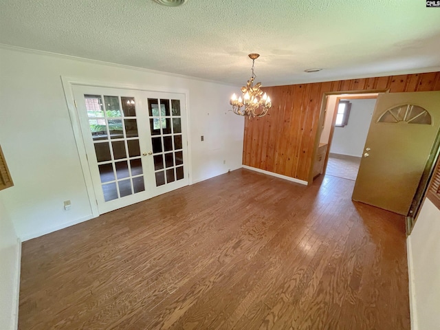 325 Beltline Ave, Batesburg, SC 29006 - unfurnished dining area featuring wood finished floors, a chandelier, french doors, a textured ceiling, and plenty of natural light