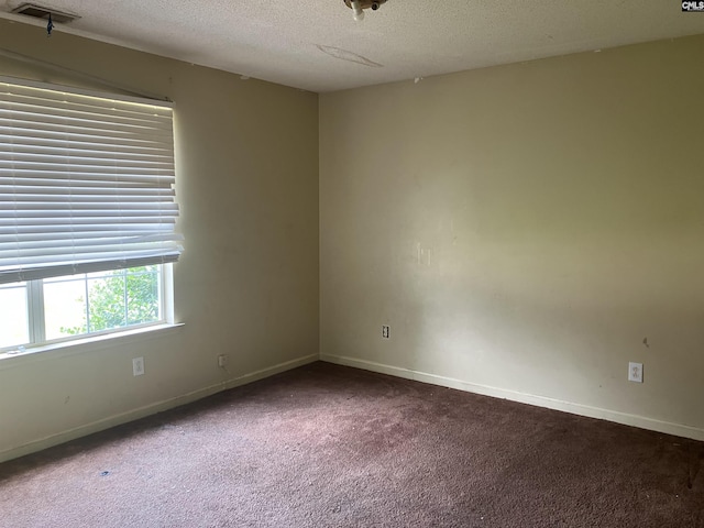 829 Martha St, Columbia, SC 29203 - carpeted empty room with a textured ceiling and baseboards
