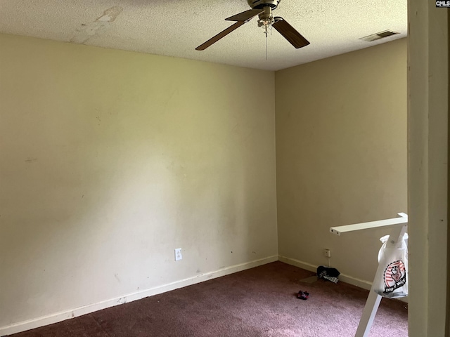 829 Martha St, Columbia, SC 29203 - spare room featuring ceiling fan, dark colored carpet, baseboards, and a textured ceiling
