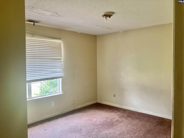 829 Martha St, Columbia, SC 29203 - carpeted spare room with a textured ceiling and baseboards