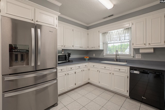 285 Freedom Blvd, Sumter, SC 29154 - kitchen featuring stainless steel appliances, a sink, dark countertops, white cabinets, and crown molding