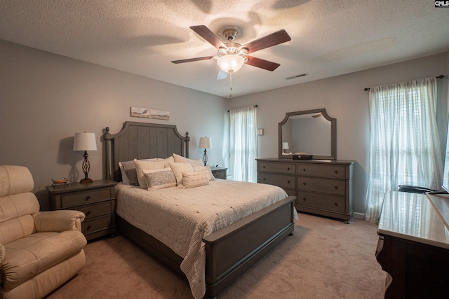285 Freedom Blvd, Sumter, SC 29154 - bedroom featuring light colored carpet, a ceiling fan, and a textured ceiling