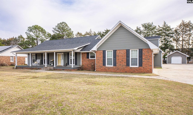 285 Freedom Blvd, Sumter, SC 29154 - single story home featuring a porch, concrete driveway, an outbuilding, brick siding, and a detached garage