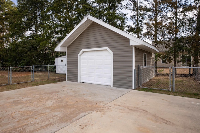 285 Freedom Blvd, Sumter, SC 29154 - detached garage with concrete driveway and a gate