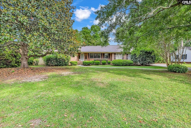 1305 Forest View Rd, Conway, SC 29526 - ranch-style home with a front lawn and metal roof