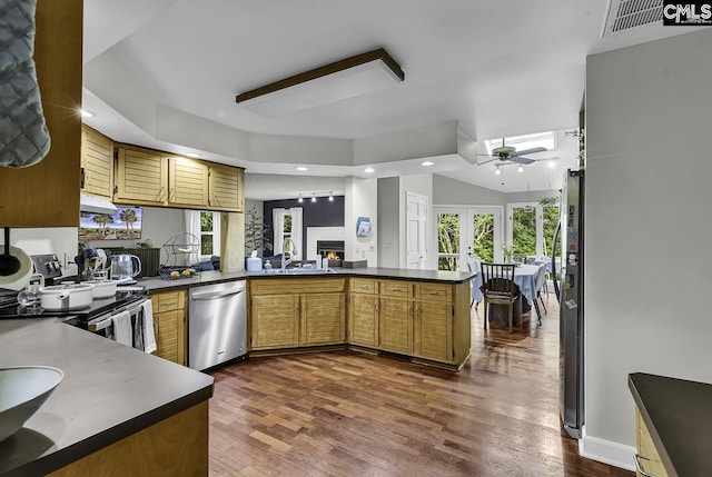 1305 Forest View Rd, Conway, SC 29526 - kitchen featuring dishwasher, a sink, dark countertops, a peninsula, and a ceiling fan