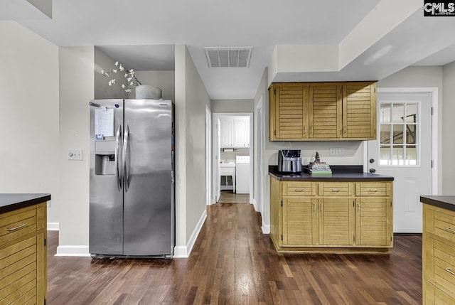 1305 Forest View Rd, Conway, SC 29526 - kitchen with stainless steel refrigerator with ice dispenser, dark countertops, dark wood-style floors, baseboards, and washer / dryer